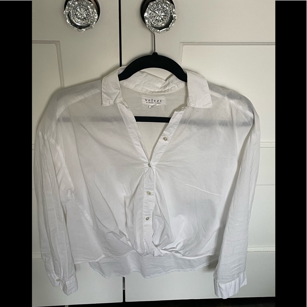 White button down with twist front detail. Shorter in front than back.